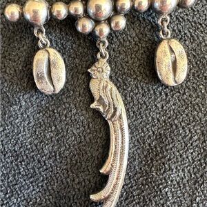 Quetzal and coffee bean vintage pin